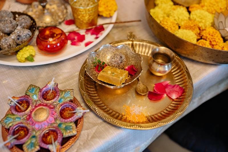 Traditional Indian food and desserts on plates
