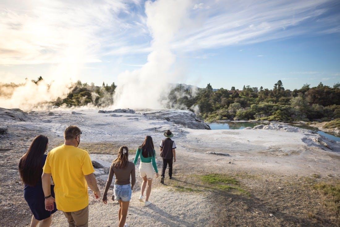 Tourists enjoying volcanic scenery in Rotorua