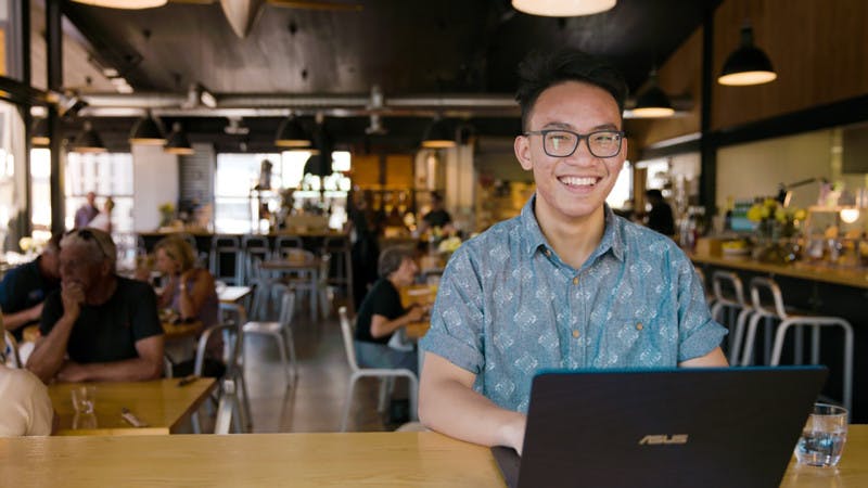 International student studying in a cafe in Auckland