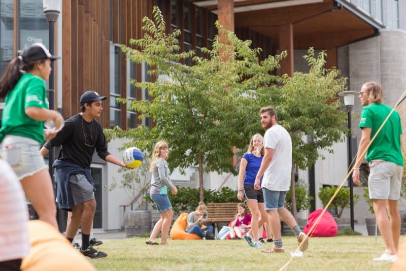 Students playing games outdoors during orientation week.