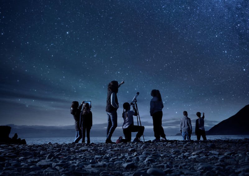 People watching a stary sky in New Zealand